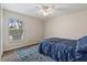 Bedroom with a blue comforter and patterned rug at 2411 Altoona Ave, North Port, FL 34286