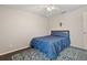 Cozy bedroom with a blue comforter and cross at 2411 Altoona Ave, North Port, FL 34286