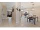 View of kitchen and dining area from hallway at 2411 Altoona Ave, North Port, FL 34286