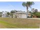 House exterior with a two-car garage at 2411 Altoona Ave, North Port, FL 34286