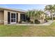 House exterior with a screened porch and landscaping at 2411 Altoona Ave, North Port, FL 34286