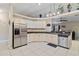 Spacious kitchen with stainless steel appliances and white cabinets at 2411 Altoona Ave, North Port, FL 34286