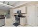 Kitchen with stainless steel appliances and white cabinets at 2411 Altoona Ave, North Port, FL 34286