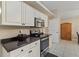 Kitchen with stainless steel appliances and dark countertops at 2411 Altoona Ave, North Port, FL 34286