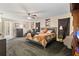 Comfortable main bedroom with a king bed and access to the bathroom at 2411 Altoona Ave, North Port, FL 34286