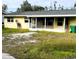 Yellow ranch house with screened porch at 2430 Dixie Ave, Punta Gorda, FL 33950