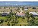 Aerial view of house and neighborhood, showcasing large lot at 24434 Rio Togas Rd, Punta Gorda, FL 33955