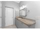 Bathroom features granite countertop, vanity, and mirror at 24434 Rio Togas Rd, Punta Gorda, FL 33955