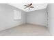 Well-lit bedroom featuring tile flooring and ceiling fan at 24434 Rio Togas Rd, Punta Gorda, FL 33955