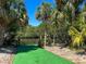 Private boat ramp with lush landscaping and access to the waterway at 24434 Rio Togas Rd, Punta Gorda, FL 33955