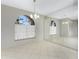 Dining area with tile floor, large window and mirrored wall at 24434 Rio Togas Rd, Punta Gorda, FL 33955