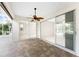 Bright enclosed patio with tile flooring and sliding glass doors at 24434 Rio Togas Rd, Punta Gorda, FL 33955