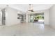 Bright living room with tile floors and sliding glass doors leading to the backyard at 24434 Rio Togas Rd, Punta Gorda, FL 33955