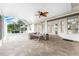 Relaxing screened patio with seating area and ceiling fan at 24434 Rio Togas Rd, Punta Gorda, FL 33955