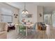 Bright dining area with a charming table and chairs, near the living room at 2476 Daisy Dr, North Port, FL 34289