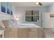 Spacious main bedroom with large windows and a calming color scheme at 2476 Daisy Dr, North Port, FL 34289