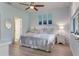 Peaceful main bedroom with light blue walls and a ceiling fan at 2476 Daisy Dr, North Port, FL 34289