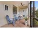 Relaxing screened porch with seating and ceiling fan at 2476 Daisy Dr, North Port, FL 34289