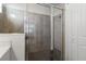 Shower with glass enclosure and gray tile at 25339 Alicante Dr, Punta Gorda, FL 33955