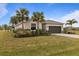 Single-story home with attached garage and landscaping at 25339 Alicante Dr, Punta Gorda, FL 33955