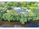 Waterfront property with a private pool and lush landscaping at 27300 San Carlos Dr, Punta Gorda, FL 33983