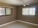 Bright bedroom with two windows and ceiling fan at 27300 San Carlos Dr, Punta Gorda, FL 33983