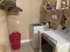 Laundry room with washer, dryer, and shelving at 27300 San Carlos Dr, Punta Gorda, FL 33983