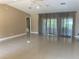 Large living area with tile floors and sliding glass doors at 27300 San Carlos Dr, Punta Gorda, FL 33983