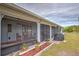 Screened porch with patio furniture and grill at 2798 Rock Creek Dr, Port Charlotte, FL 33948