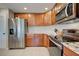 Kitchen with stainless steel appliances and wood cabinets at 2798 Rock Creek Dr, Port Charlotte, FL 33948