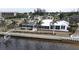 Aerial view of waterfront home with pool and dock at 311 Bayridge Pl, Punta Gorda, FL 33950