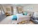 Main bedroom with king-size bed, plush bedding, and plenty of natural light at 311 Bayridge Pl, Punta Gorda, FL 33950