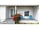 Front porch with seating and vibrant flowers at 311 Bayridge Pl, Punta Gorda, FL 33950