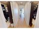 Long hallway with two large walk-in closets and hardwood floors at 311 Bayridge Pl, Punta Gorda, FL 33950