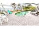 Inviting screened pool with patio furniture and water views at 311 Bayridge Pl, Punta Gorda, FL 33950