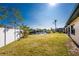 Backyard with canal and white fence at 3200 Colony Ct, Punta Gorda, FL 33950