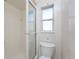 Small bathroom with shower, toilet, and window at 3200 Colony Ct, Punta Gorda, FL 33950