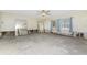 Needs renovation, large bedroom with mirrored walls and ceiling fan at 3200 Colony Ct, Punta Gorda, FL 33950