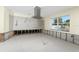 Kitchen with stainless steel range hood and tiled floors at 3200 Colony Ct, Punta Gorda, FL 33950