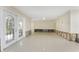 Living room with tiled floors and large glass french doors at 3200 Colony Ct, Punta Gorda, FL 33950