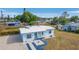 Cute light blue home with a gravel driveway at 3740 Easy St, Port Charlotte, FL 33952