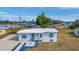 Cute light blue home with a gravel driveway at 3740 Easy St, Port Charlotte, FL 33952