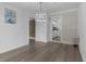 Dining room with wood-look floors and kitchen access at 3740 Easy St, Port Charlotte, FL 33952