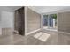 Hallway with barn door and wood-paneled accent wall at 3740 Easy St, Port Charlotte, FL 33952