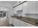 White kitchen with butcher block countertops and subway tile backsplash at 3740 Easy St, Port Charlotte, FL 33952