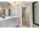 Bathroom with single vanity and walk-in closet access at 3959 San Rocco Dr # 312, Punta Gorda, FL 33950