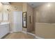 Bathroom with walk-in shower, double vanity, and linen closet at 3959 San Rocco Dr # 312, Punta Gorda, FL 33950