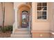 Inviting entryway with a double door and elegant columns at 3959 San Rocco Dr # 312, Punta Gorda, FL 33950