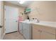 Laundry room with washer, dryer, and storage at 3959 San Rocco Dr # 312, Punta Gorda, FL 33950