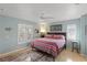 Bright bedroom with a king-size bed and ceiling fan at 4122 Library St, Port Charlotte, FL 33948